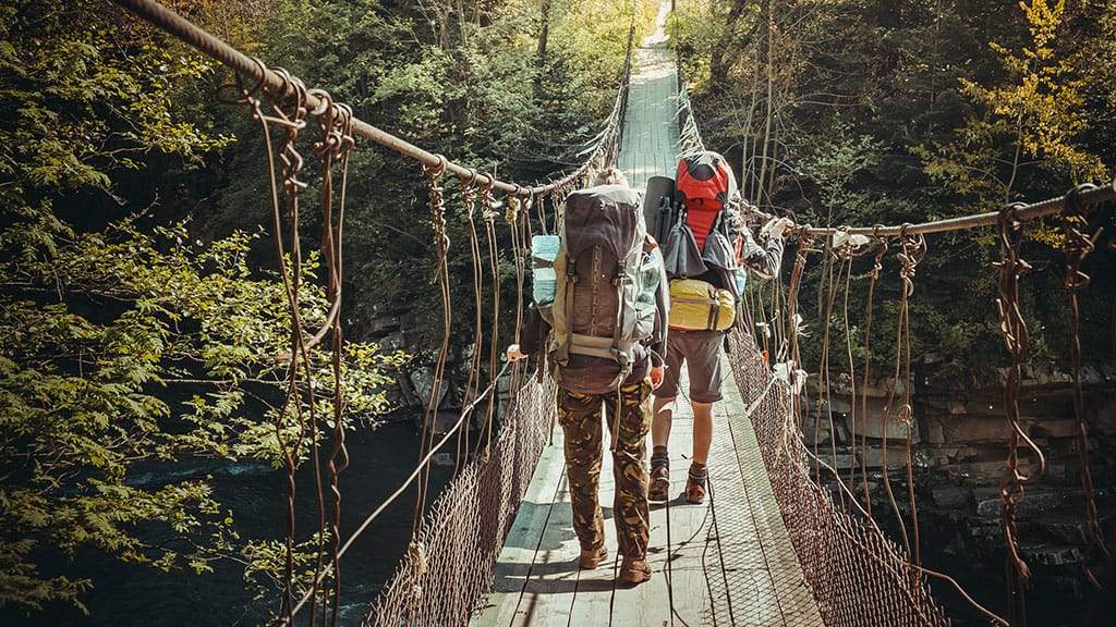 travelers-crossing-through-hanging-bridge.jpg